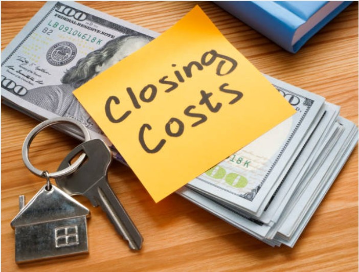 A stack of papers with a calculator, representing mortgage closing costs in Arizona